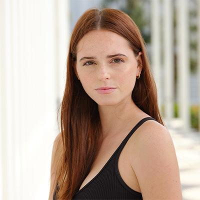 a woman in an angle posing for headshot